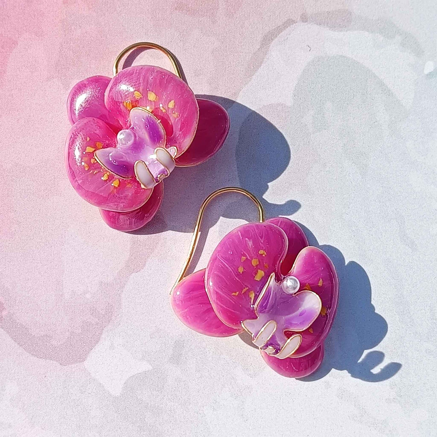 Handcrafted pink orchid enamel earrings with gold hooks and pearl center