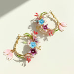 Floral hoop earrings on a light background