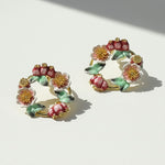 Pair of floral earrings on a light background