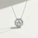 Dancing moissanite halo pendant with spinning center stone