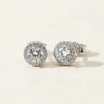 Platinum-plated sterling silver stud earrings with 0.5ct lab-grown moissanite center stones and halo design.