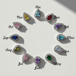 Teardrop birthstone stud earrings in 12 colors for each month, platinum-plated silver with halo cubic zirconia setting.