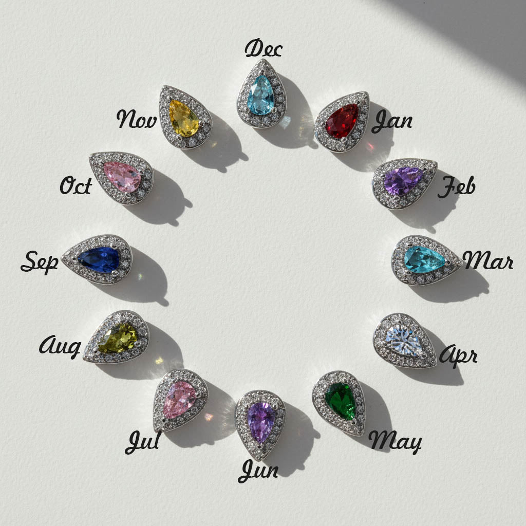Teardrop birthstone stud earrings in 12 colors for each month, platinum-plated silver with halo cubic zirconia setting.