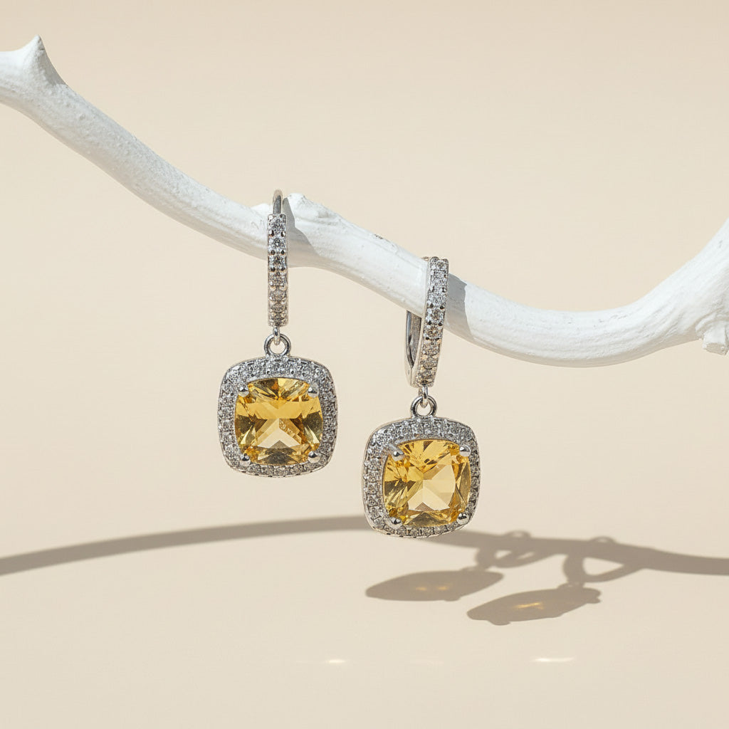 Citrine birthstone dangle earrings with cushion-cut yellow stones and halo CZ, platinum-plated silver leverback design.