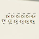 Twelve mother-of-pearl flower charms with cubic zirconia birthstones for each month from January to December.