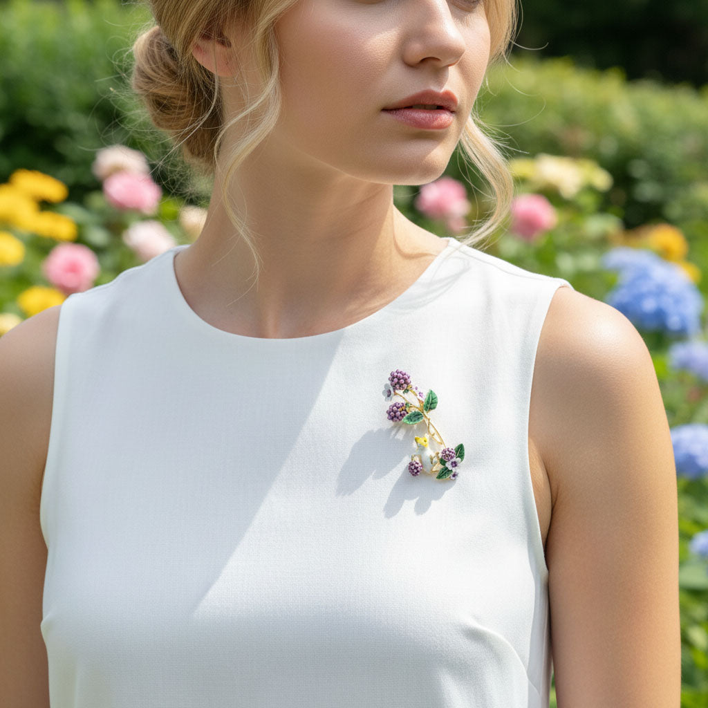 Woman wearing a white sleeveless top with a floral brooch in a garden setting