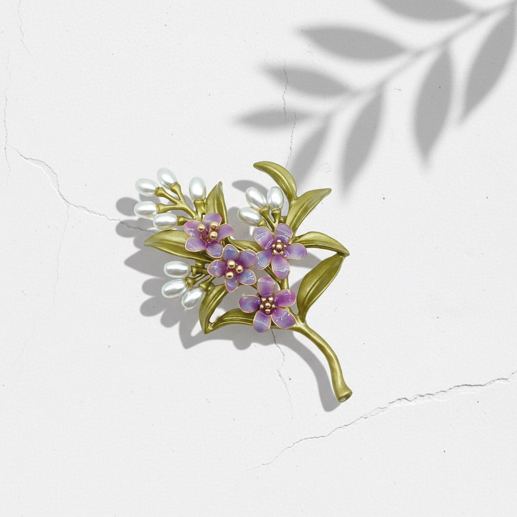 Purple floral brooch made from hand-painted resin on brass base