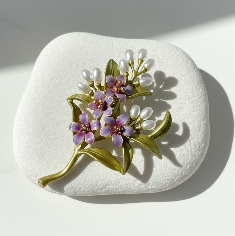 Handcrafted purple resin flower brooch with green leaves and pearl-like buds