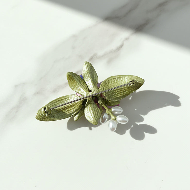 Back view of handcrafted orchid brooch pin