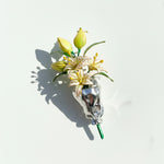 Hand-painted resin flower brooch with green leaves and bud details