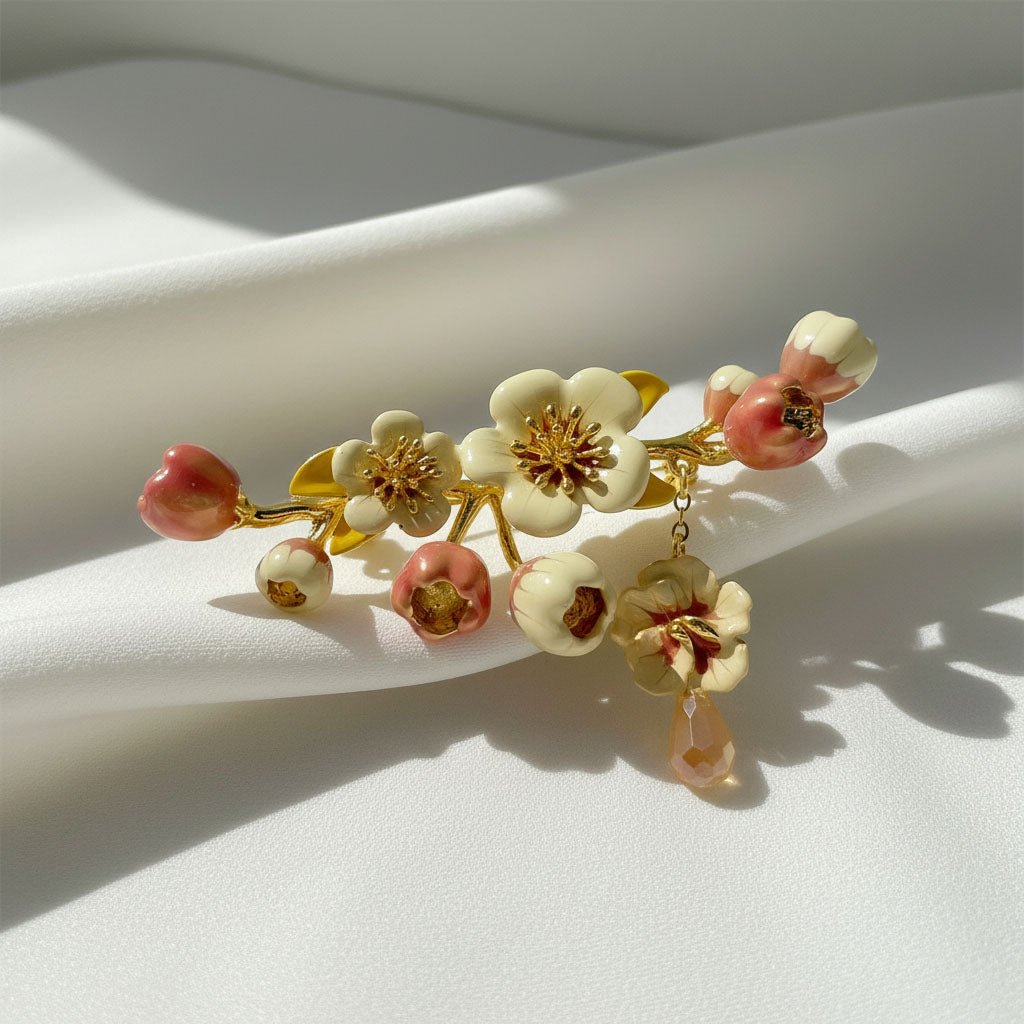 Floral brooch with pink and white flowers on a white background
