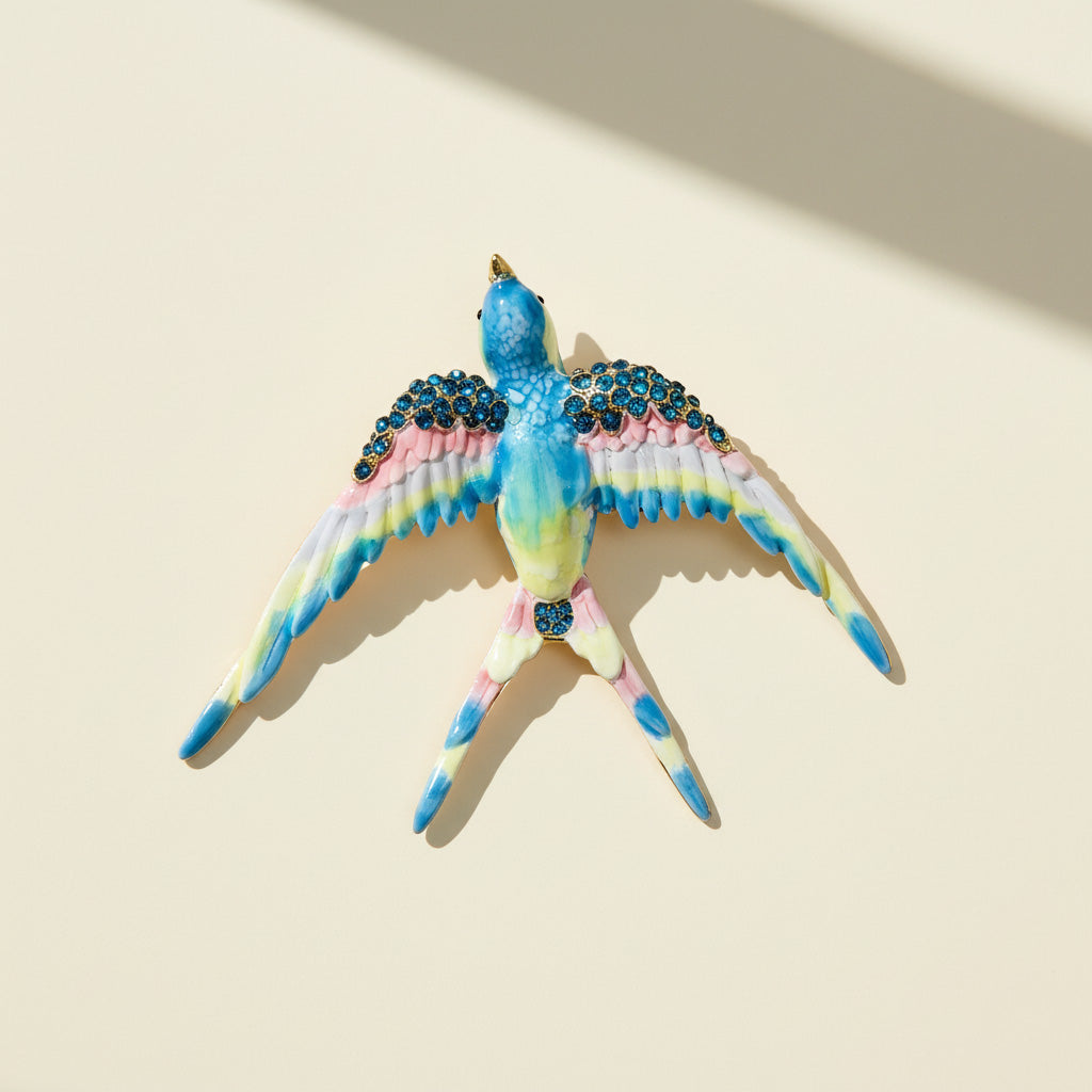 Decorative bird figurine with colorful feathers and gemstones on a beige background
