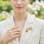 Woman wearing a decorative brooch on her white blazer outdoors