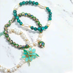 Beaded necklace with a floral pendant on a light background