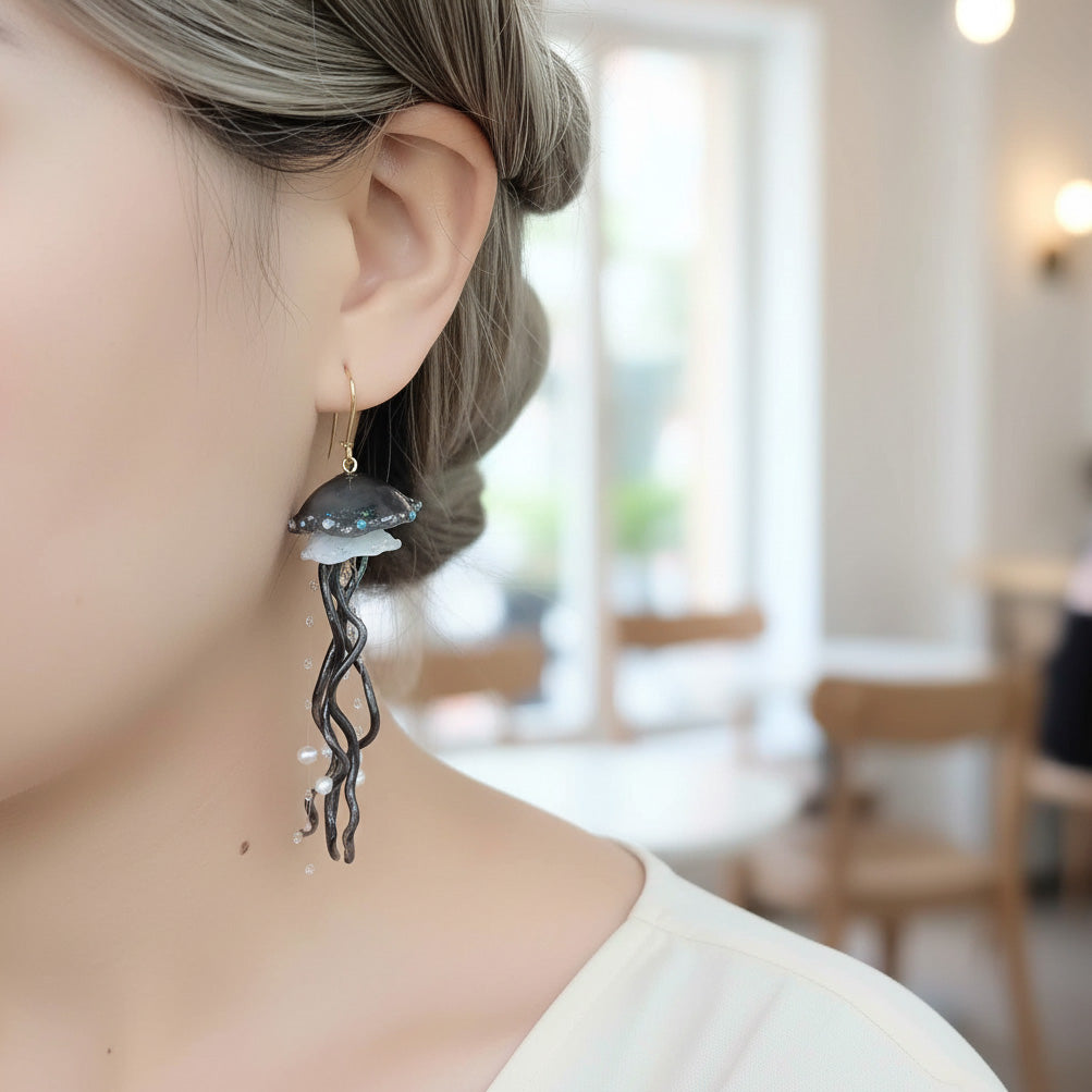 Person wearing a unique earring with a blurred indoor background