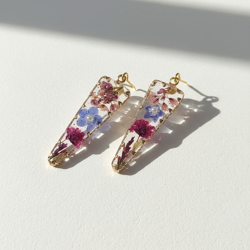 Pair of floral hair clips on a white background