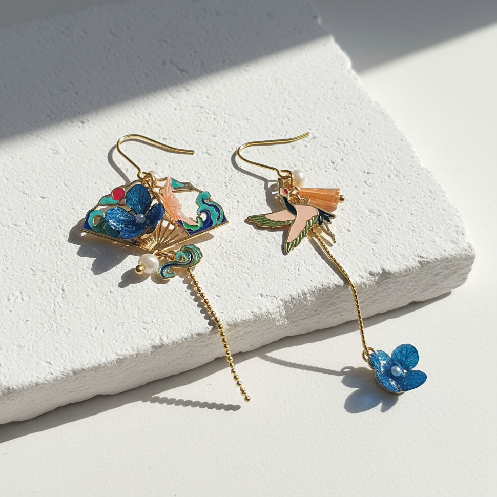 Mismatched hydrangea and crane enamel earrings in gold plating with pearls by A2K London