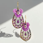 Purple floral mandala drop earrings with MOP shell and CZ stones on white background