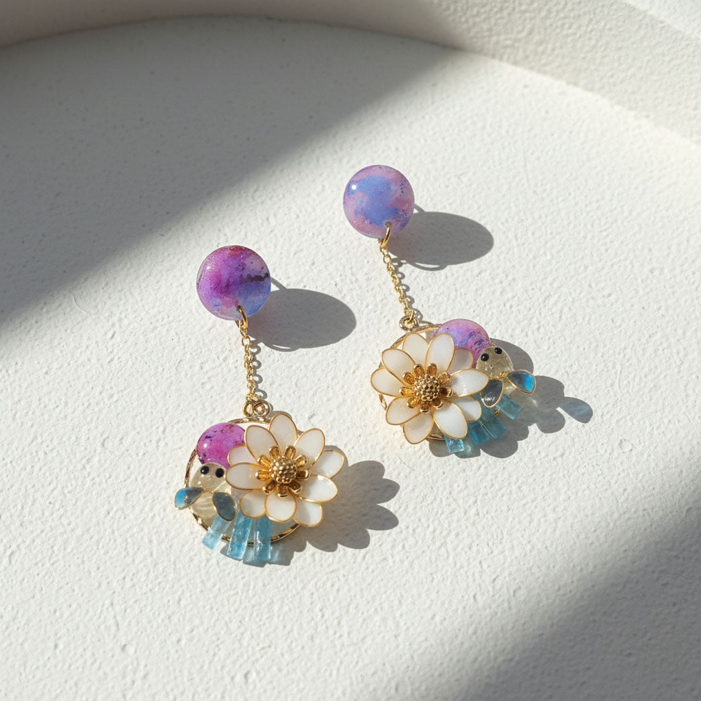 Pair of floral earrings with colorful beads on a light background
