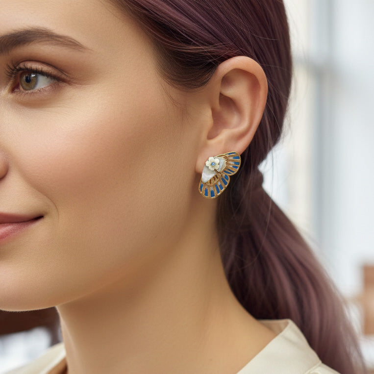 Close-up of a woman wearing a decorative earring with a blurred background