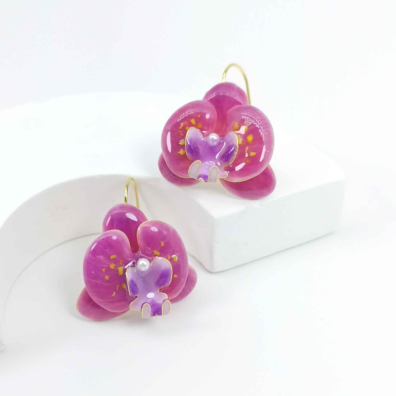 Handcrafted pink orchid enamel earrings with gold hooks and pearl center