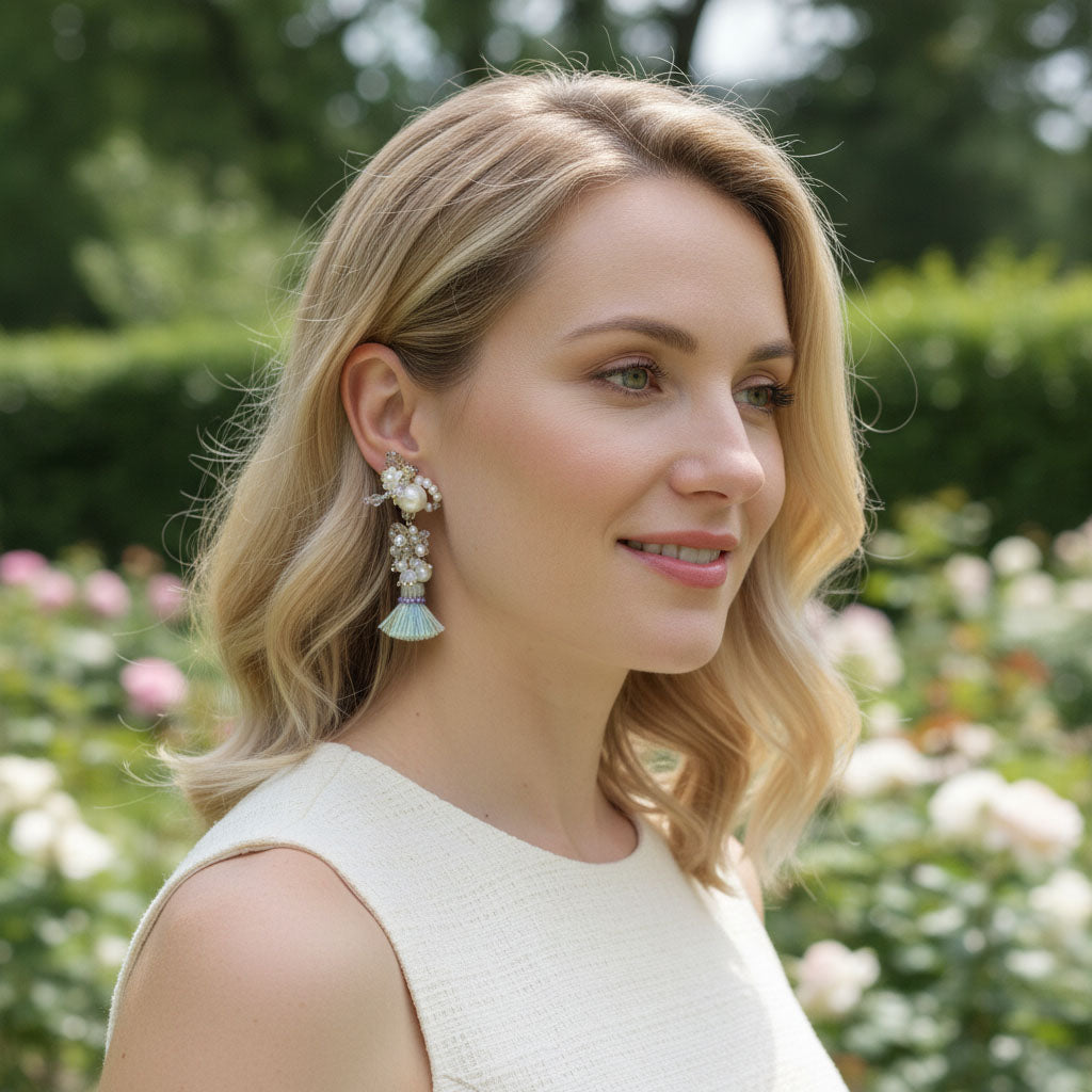 Woman wearing earrings with a blurred floral background