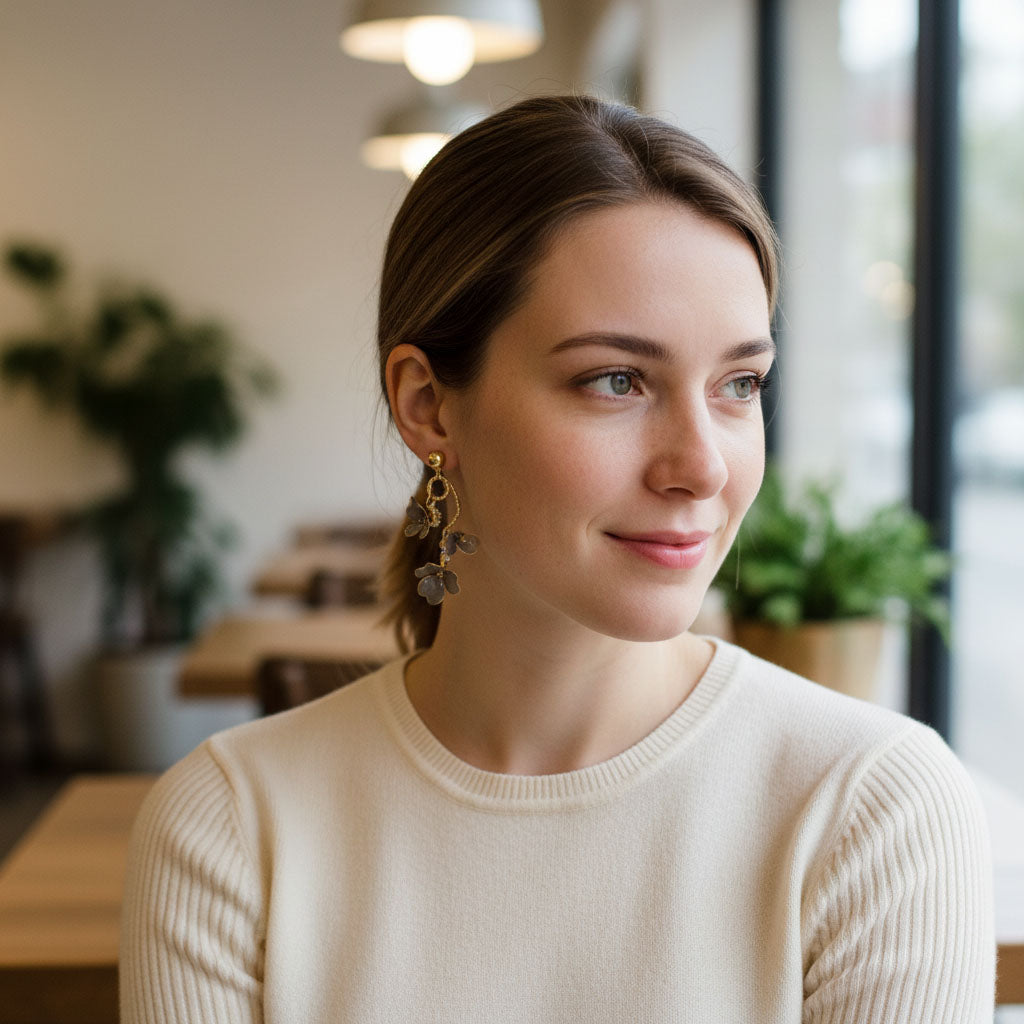 Woman wearing a beige sweater in a casual indoor setting