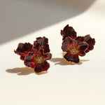 Pair of floral earrings on a light background