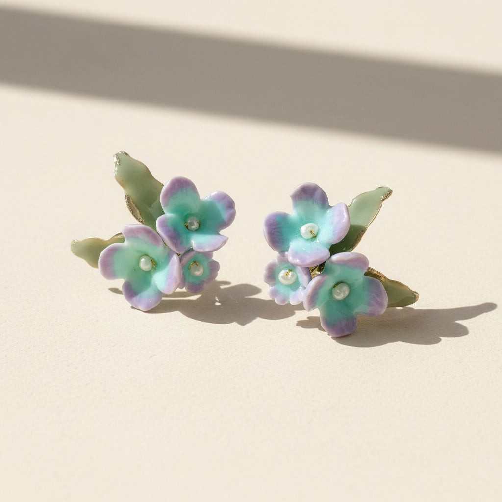 Pair of floral earrings on a beige background
