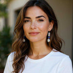 Woman wearing earrings with a blurred background