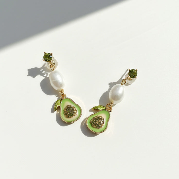Hand-painted avocado earrings with pearls and CZ studs in gold-plated brass.