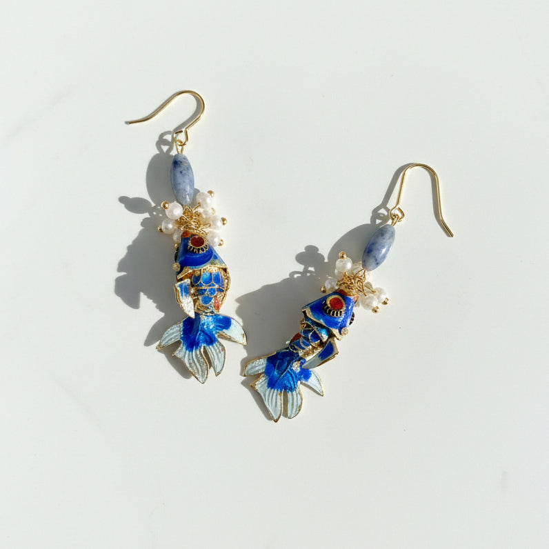 Hand-painted blue cloisonné koi fish earrings with pearls and gemstones.