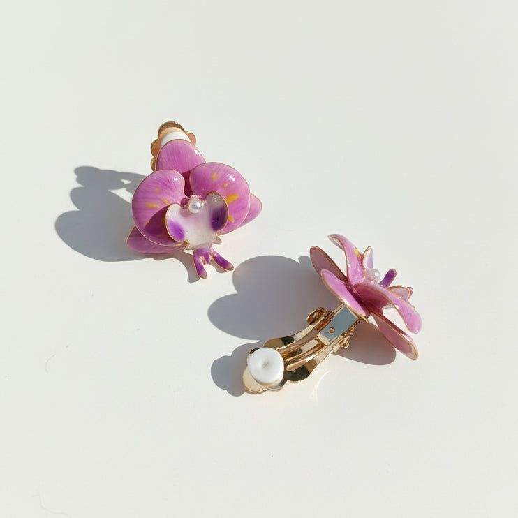 Purple orchid floral resin clip-on earrings with pearl center