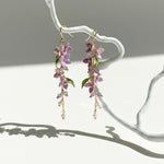 Hanging wisteria resin earrings with amethyst beads and freshwater pearls.