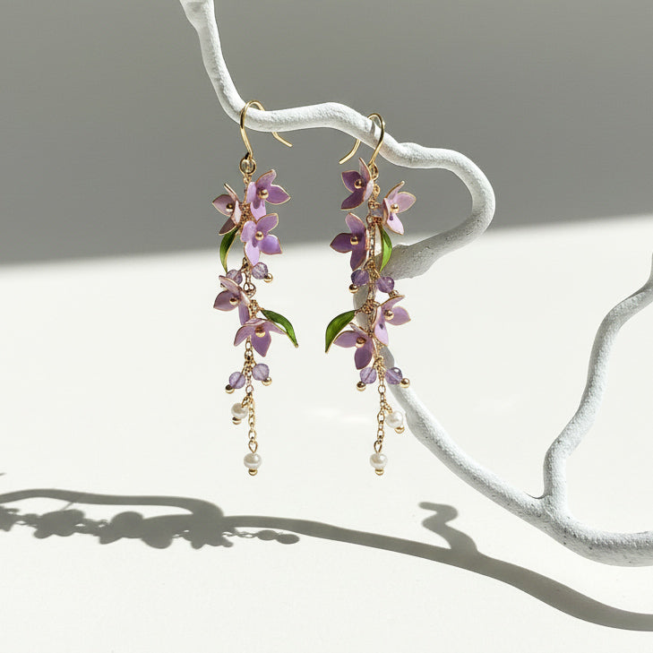 Hanging wisteria resin earrings with amethyst beads and freshwater pearls.