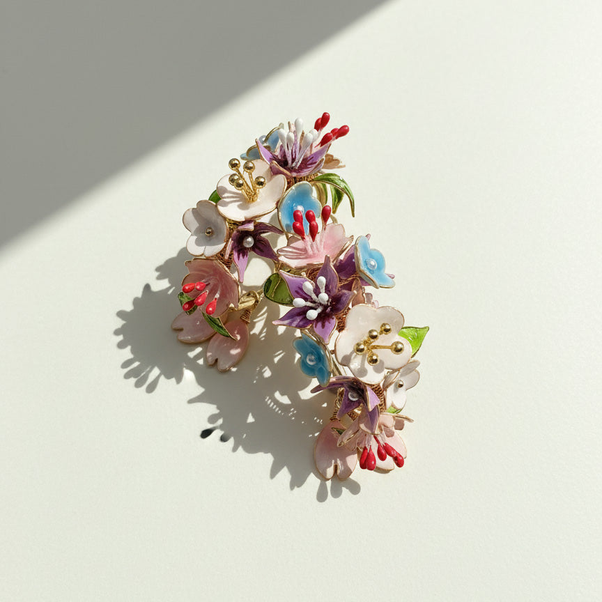 Colorful floral earrings on a light background