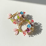 Decorative wreath with colorful flowers on a light background