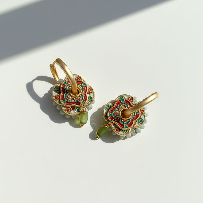 Cloisonné floral earrings with green glass and pearl accents.