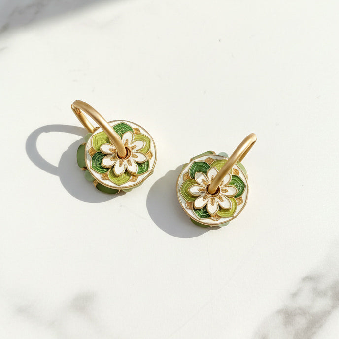 Reverse side showing enamel floral detailing in green and gold