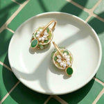 Gold-plated multi-way floral hoop earrings with jade-green enamel.