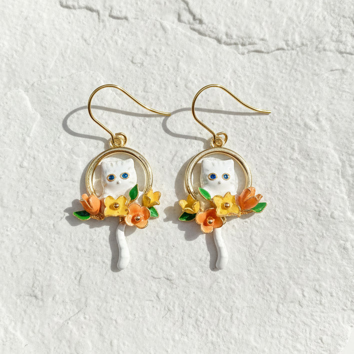 Artisan enamel cat earrings with hand-painted floral accents