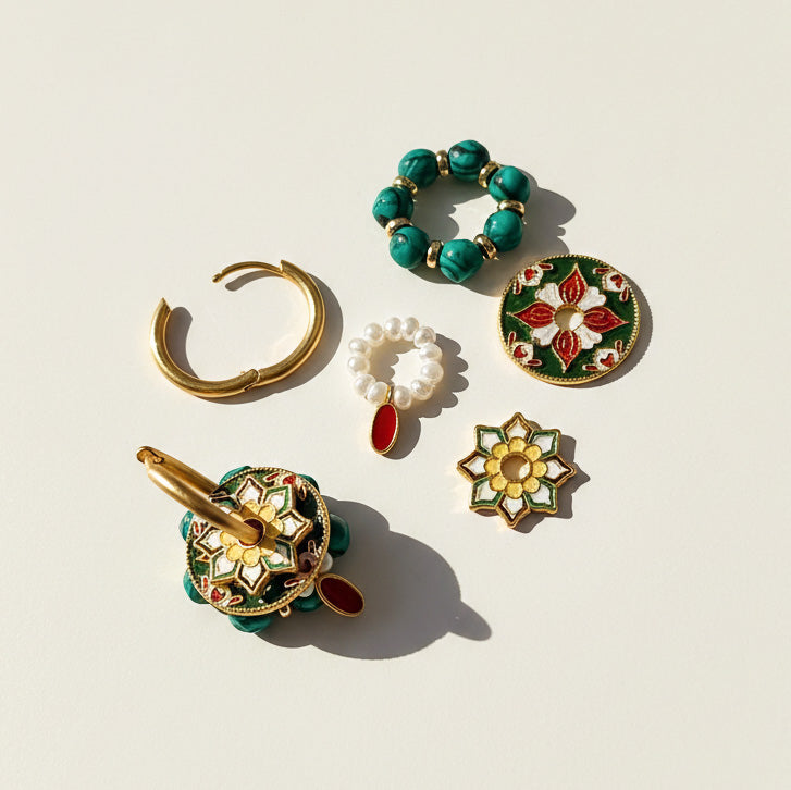 Collection of decorative earrings on a light beige background