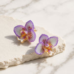 Handcrafted orchid flower earrings with purple resin petals and gold-plated detailing