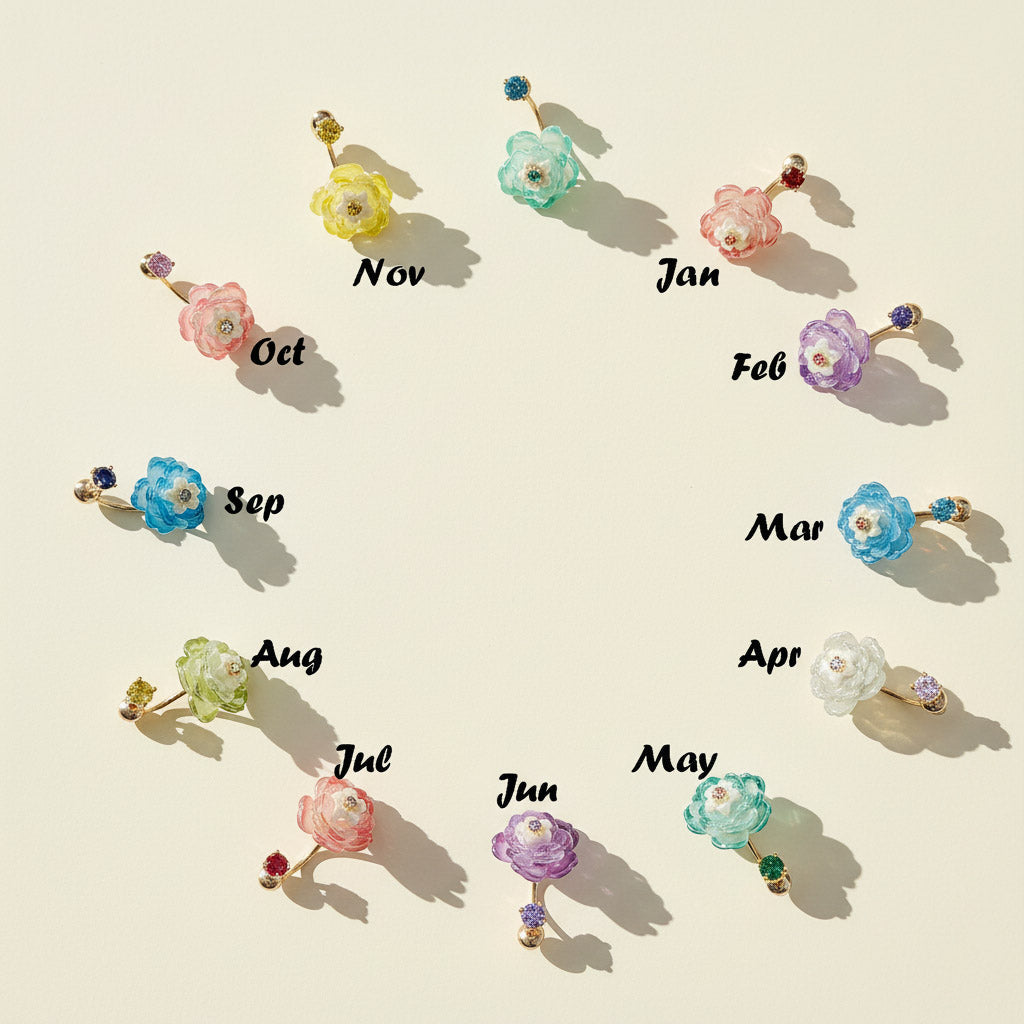 Set of floral earrings with months labeled on a beige background