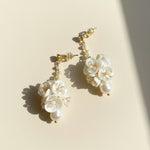 Porcelain flower drop earrings with freshwater pearls and gold-plated finish.
