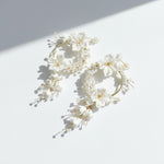 Floral hoop earrings on a white background