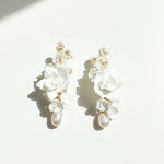 White porcelain bridal earrings with cascading pearls and floral design