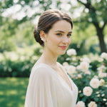 Side view of model wearing floral ear climber earrings with cascading pearls.