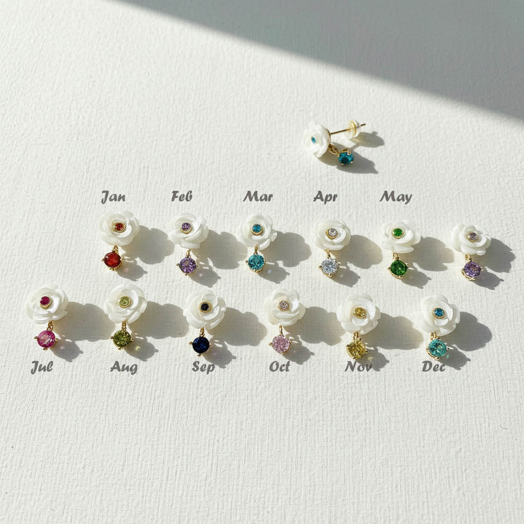Mother-of-pearl flower stud earrings with 12 birthstone colors labeled by month from January to December