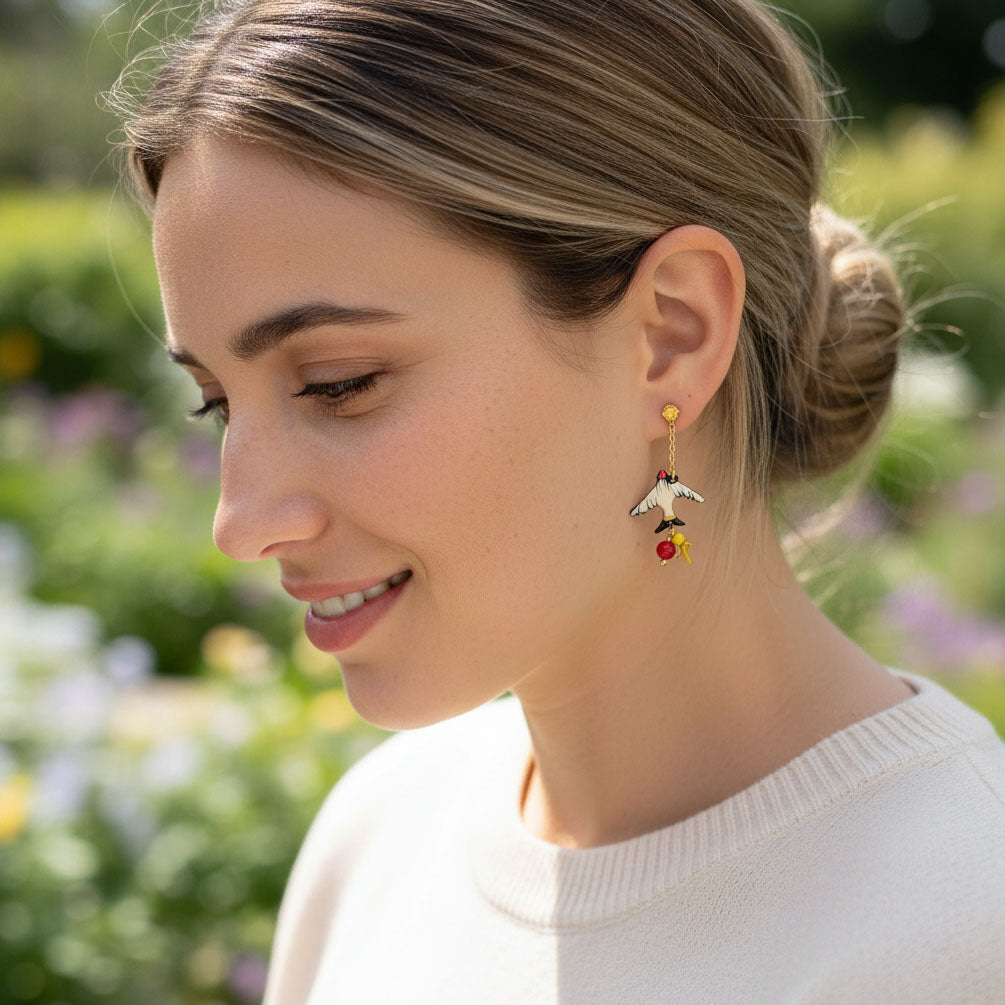 Woman wearing a unique earring with a blurred natural background